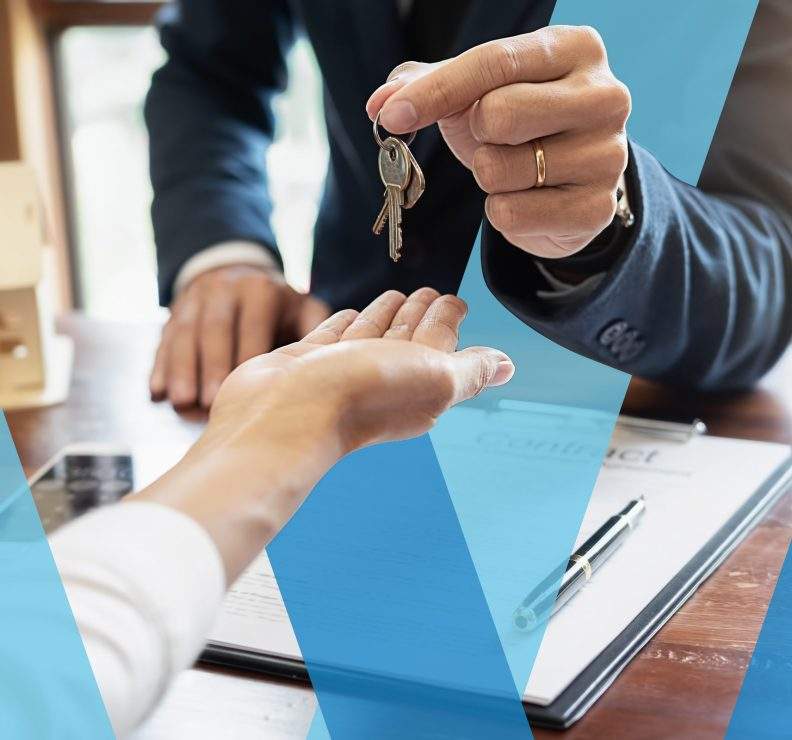 Landlord handing over keys to a tenant